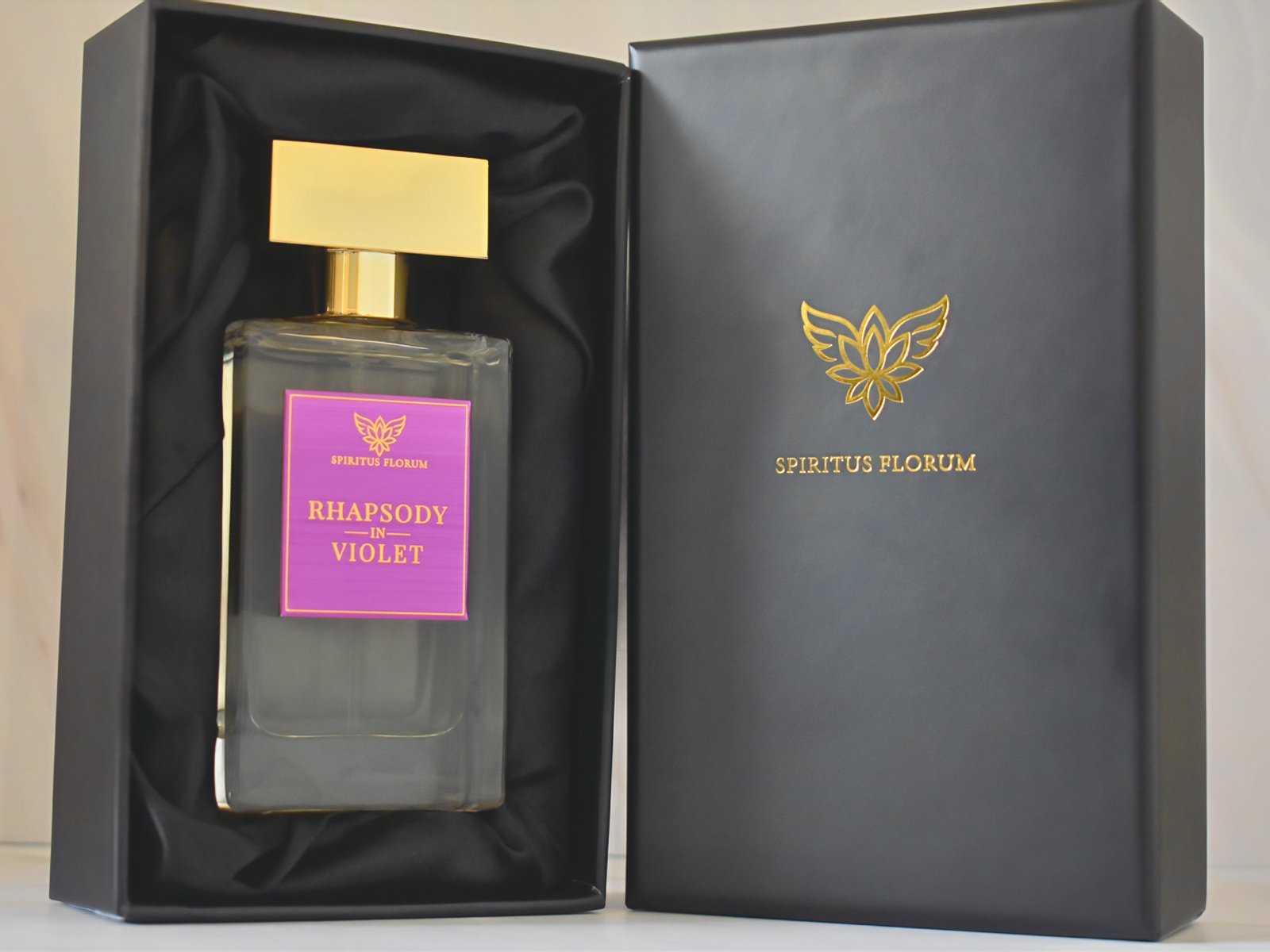 Rhapsody in Violet in its open black presentation box with the gold Spiritus Florum emblem